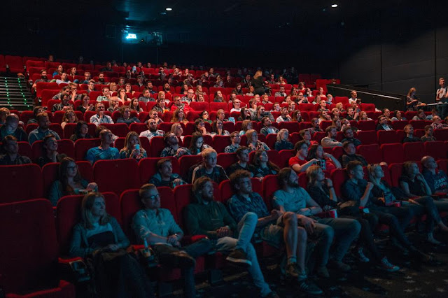 People sat in a cinema watching a film